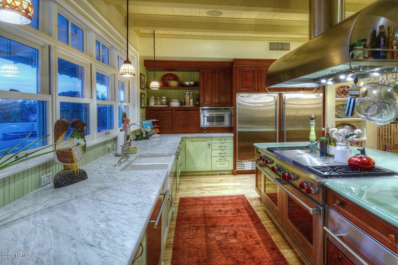 A large kitchen with stainless steel appliances