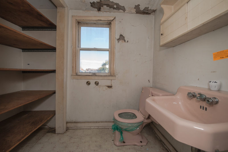 Bathroom with pink fixtures before remodel