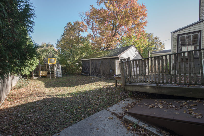 Backyard of small cape before new landscaping