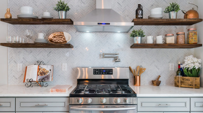 A stove top oven sitting inside of a kitchen