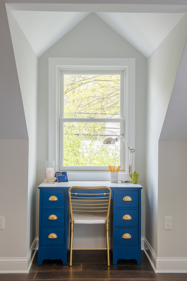 Blue desk in dormer window