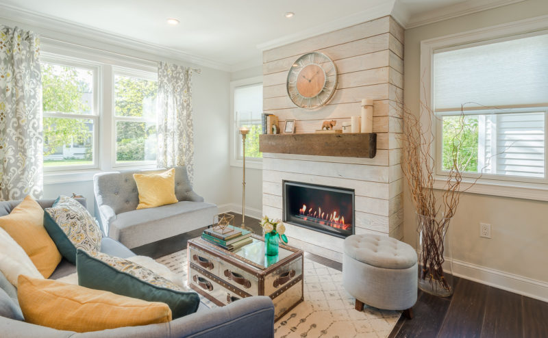 A living room filled with furniture and a fire place