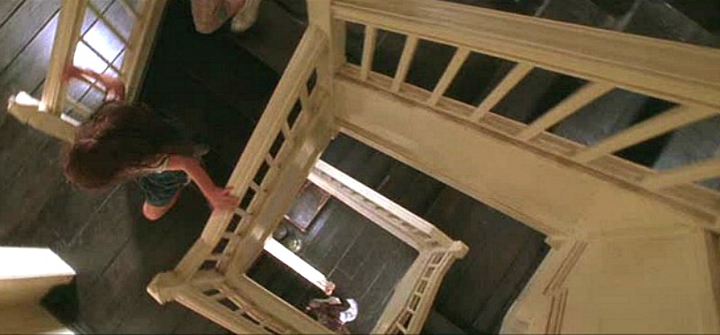 looking down staircase in Practical Magic house