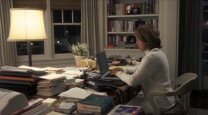 Diane Keaton sitting at the desk working on a laptop in Erica\'s bedroom