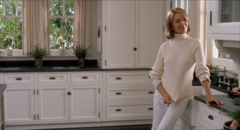 Diane Keaton standing in a kitchen