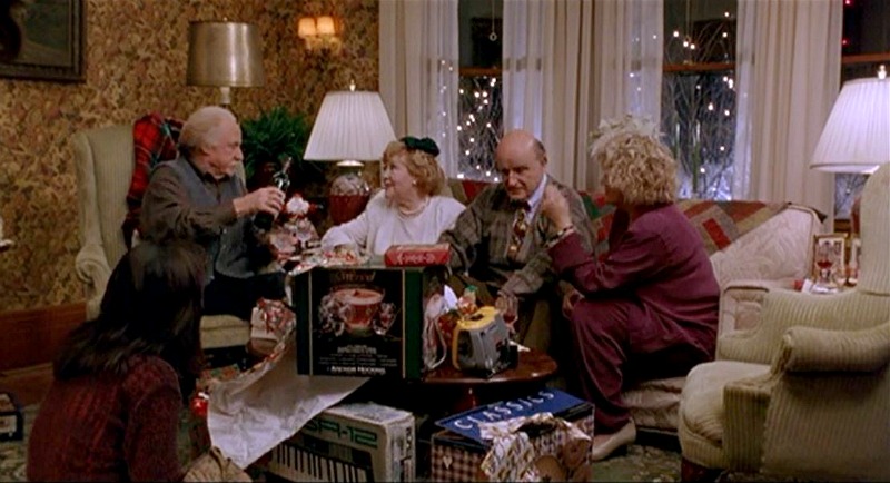 Screenshot of family opening Christmas gifts in the living room