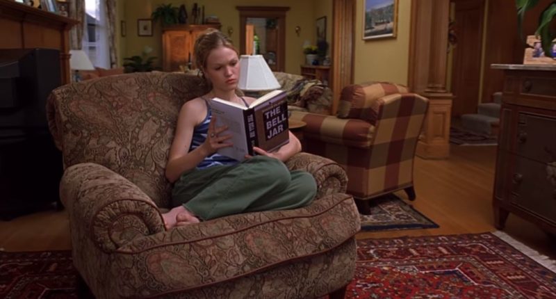 Julia Stiles sitting in a living room