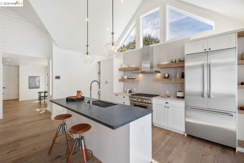 A kitchen with a wood floor