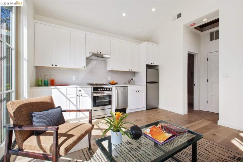 A kitchen with a dining room table inside guest cottage