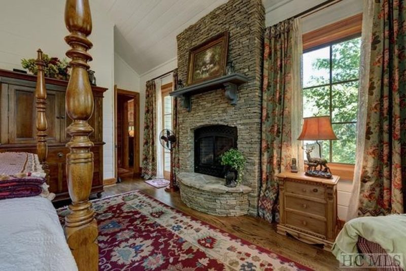 Stone fireplace in bedroom