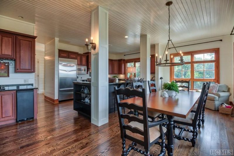 A kitchen with a dining room table