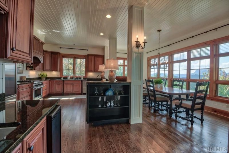 A modern kitchen with stainless steel appliances and wooden cabinets