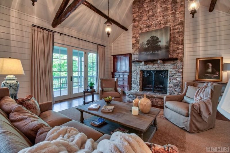 A view of a living room filled with furniture and a fireplace