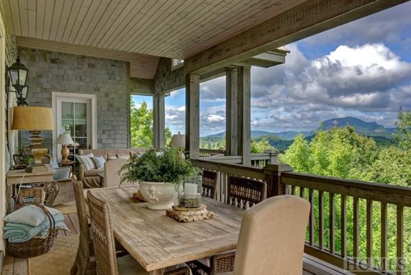 Dining table and chairs on back porch