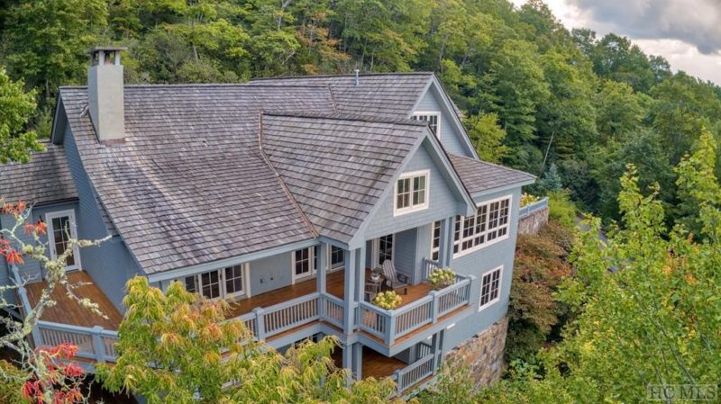 Aerial view of back exterior of house in mountains