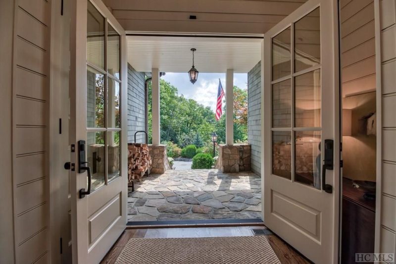 Open double doors leading to front porch