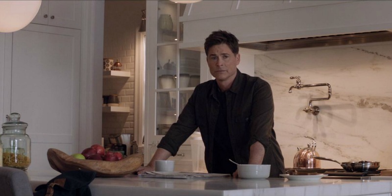 Rob Lowe cooking in a kitchen