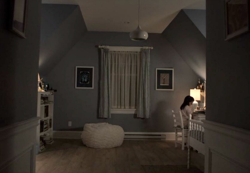 Gray bedroom with slanted ceiling