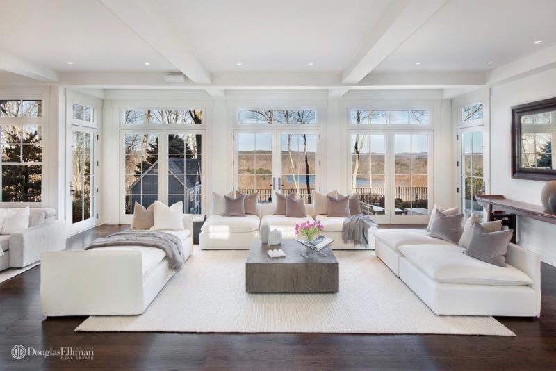 A living room filled with furniture and a large window