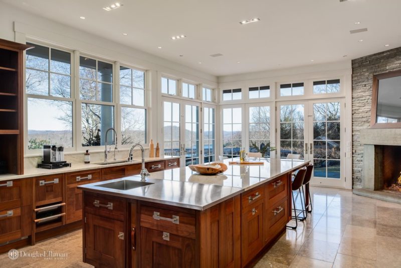 A large kitchen with an island in the middle of a room