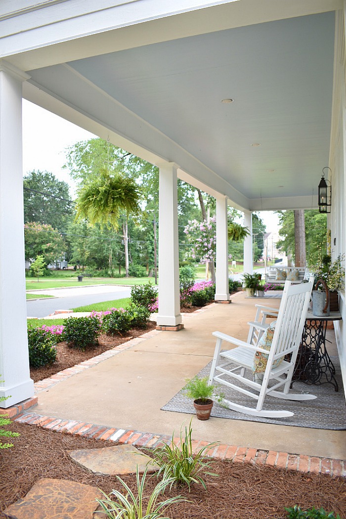 white cottage front porch with blue ceiling