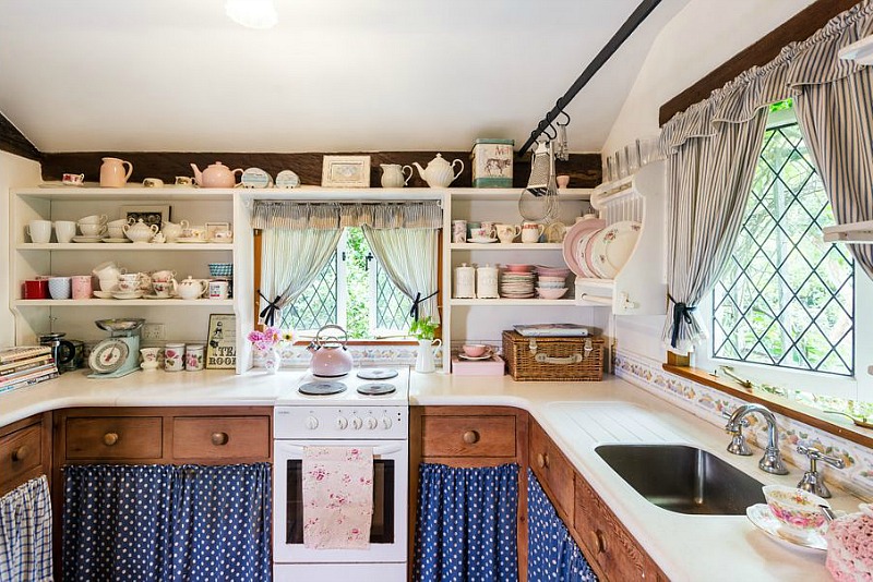 Small cottage kitchen with skirted lower cabinets