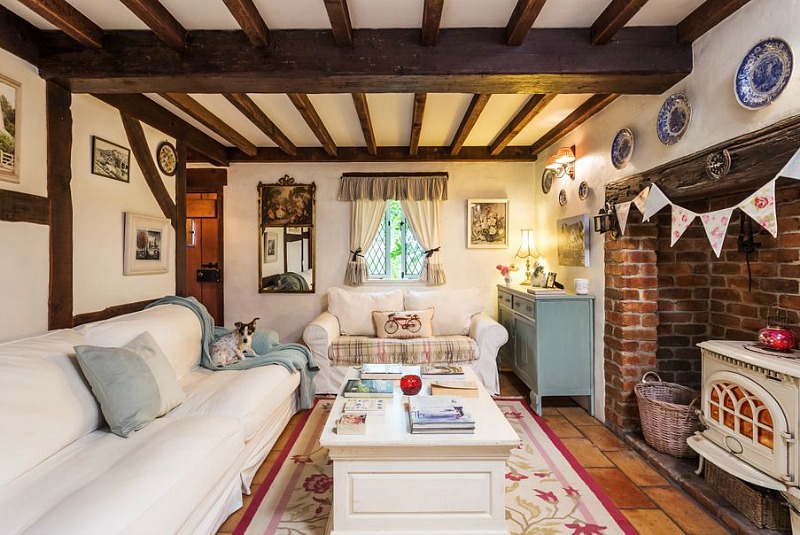 Small cottage living room with white sofas