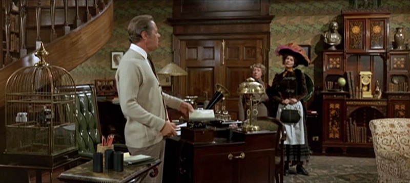 Screenshot of Rex Harrison at his desk in My Fair Lady movie