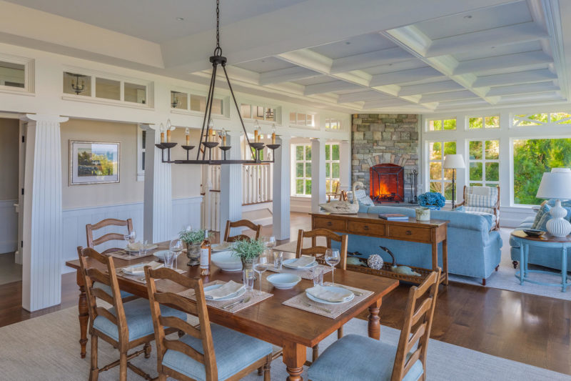 A dining room table and chairs in Cape Cod beach house