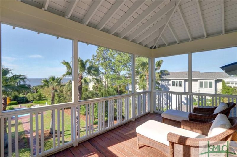 Screened porch with view of the water