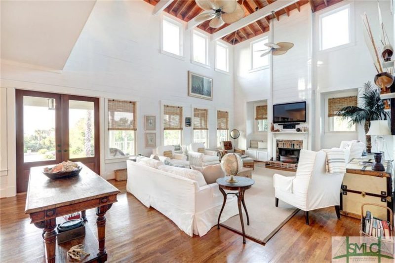 A living room filled with furniture and a large window