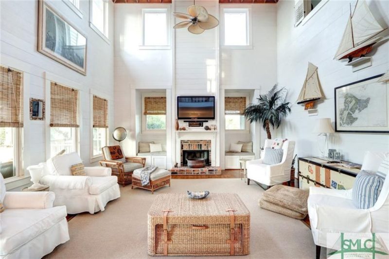 A living room filled with furniture and a fire place