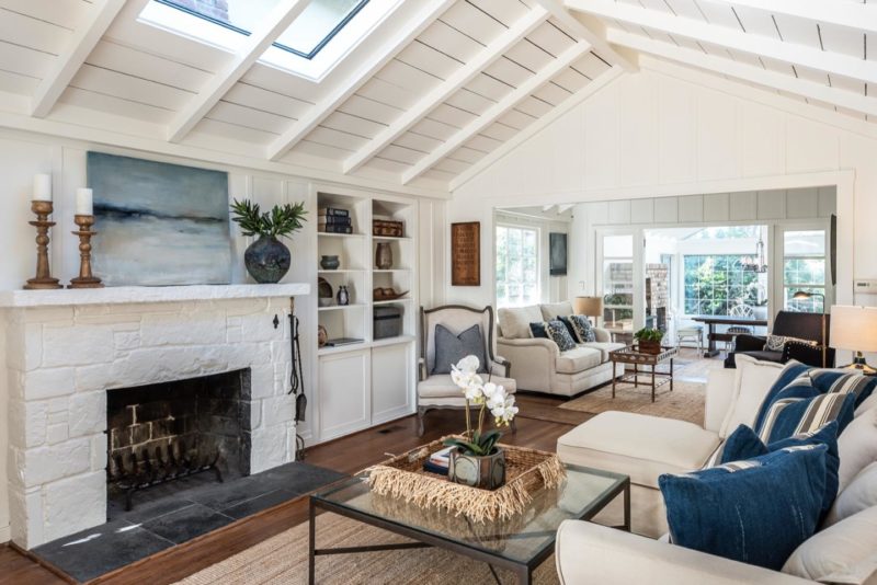 A living room filled with furniture and a fire place