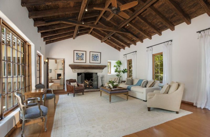 A living room filled with furniture and a fireplace