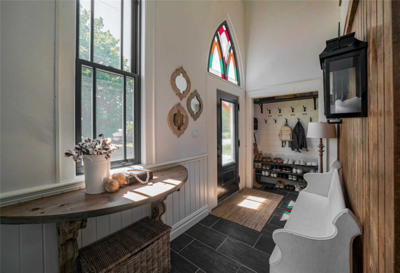 Entry hall with stained-glass window above door