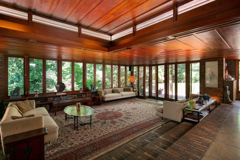 Living room with walls of windows in Frank Lloyd Wright Sondern-Adler House 