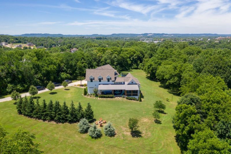 Aerial view of modern farmhouse on 5 acres