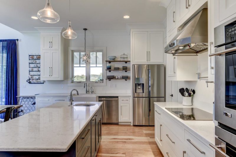 A large kitchen with stainless steel appliances