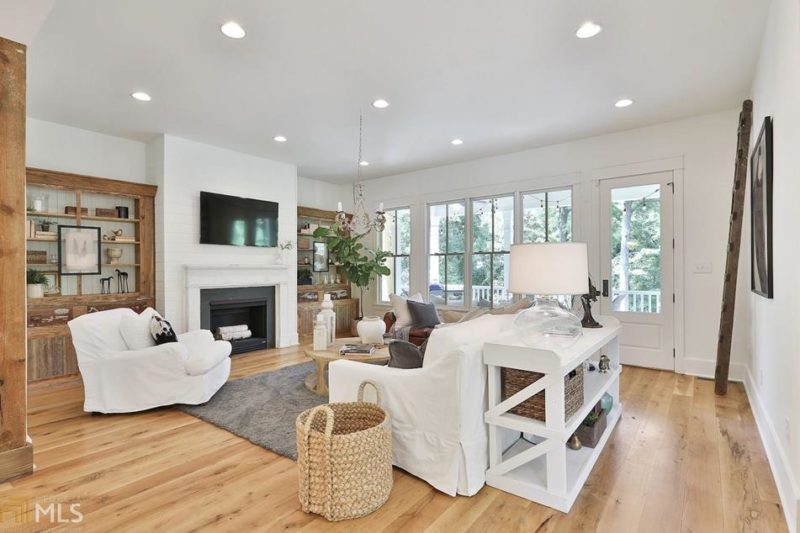 A living room filled with furniture and a large window