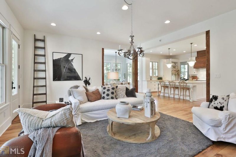 A living room with white sofa