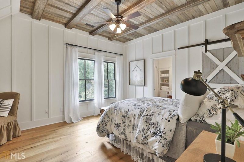 Farmhouse bedroom with board-and-batten walls