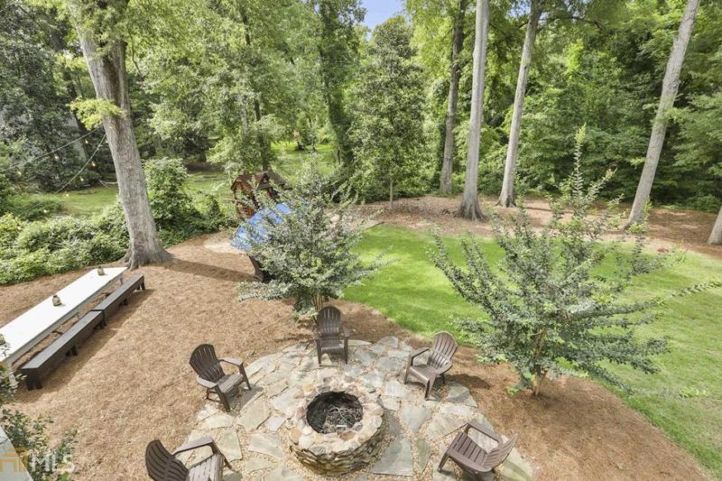 View of fire pit and chairs from back porch