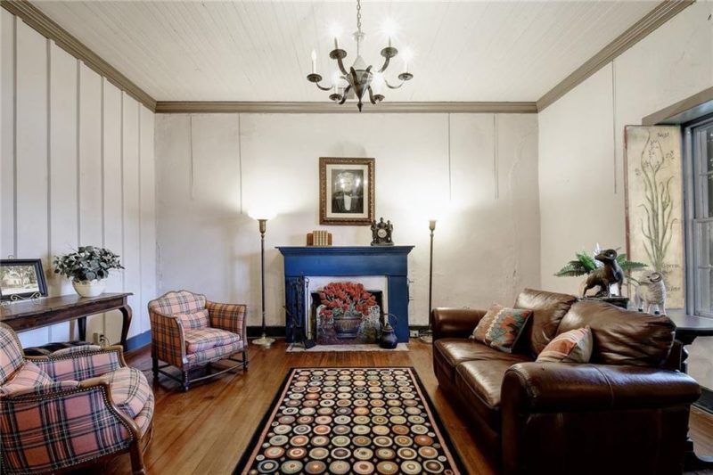 A living room filled with furniture and a fire place