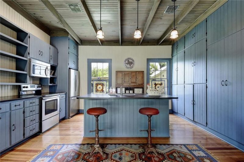 Kitchen with blue cabinets and island