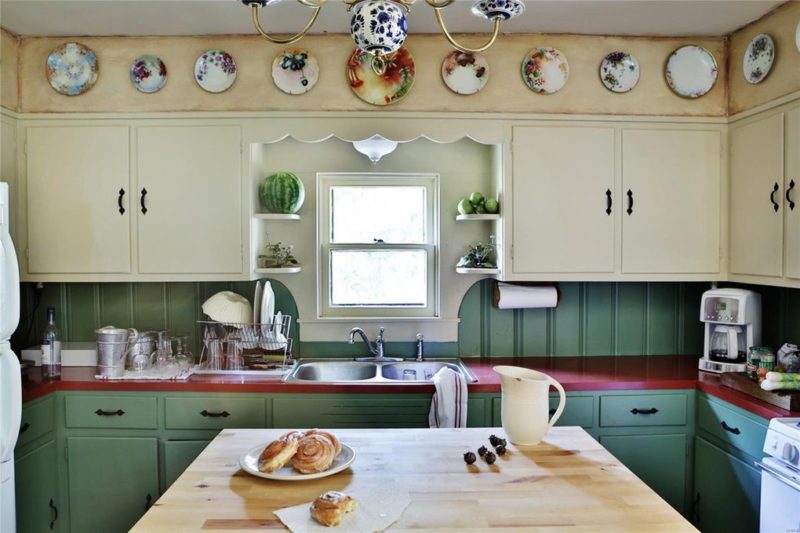 Kitchen sink with decorative plates on wall