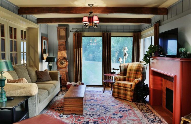 Cottage living room with blue-painted paneled walls