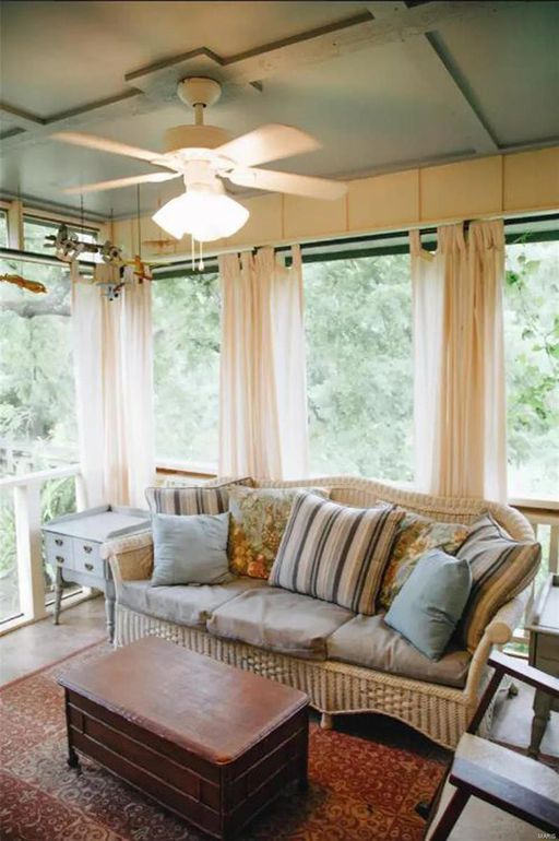 Screened porch with wicker sofa