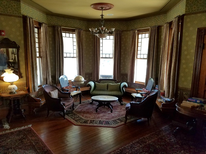 A living room filled with furniture and a large window