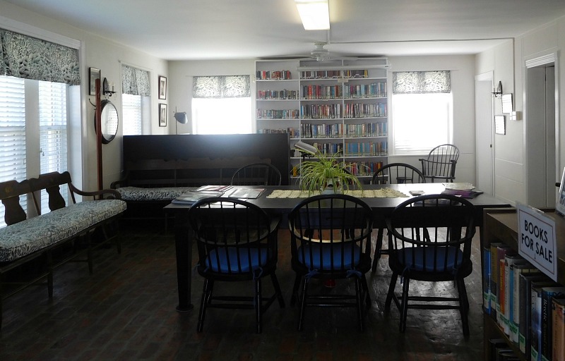 Inside Beach Haven Public Library with bookshelves and table with chairs