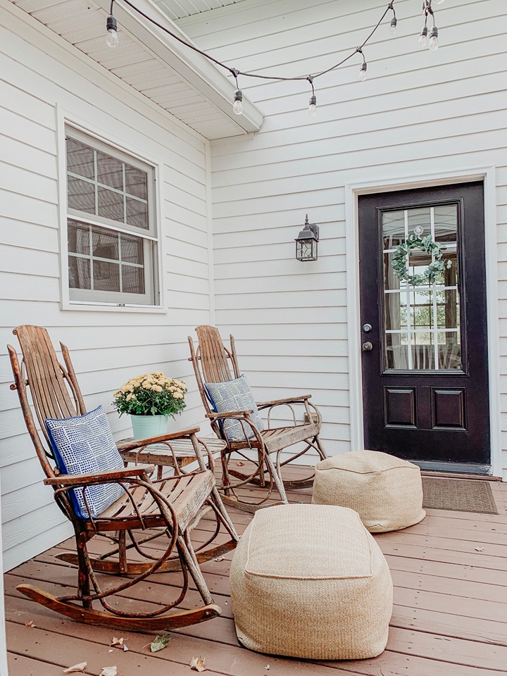 Two chairs on back deck of farmhouse